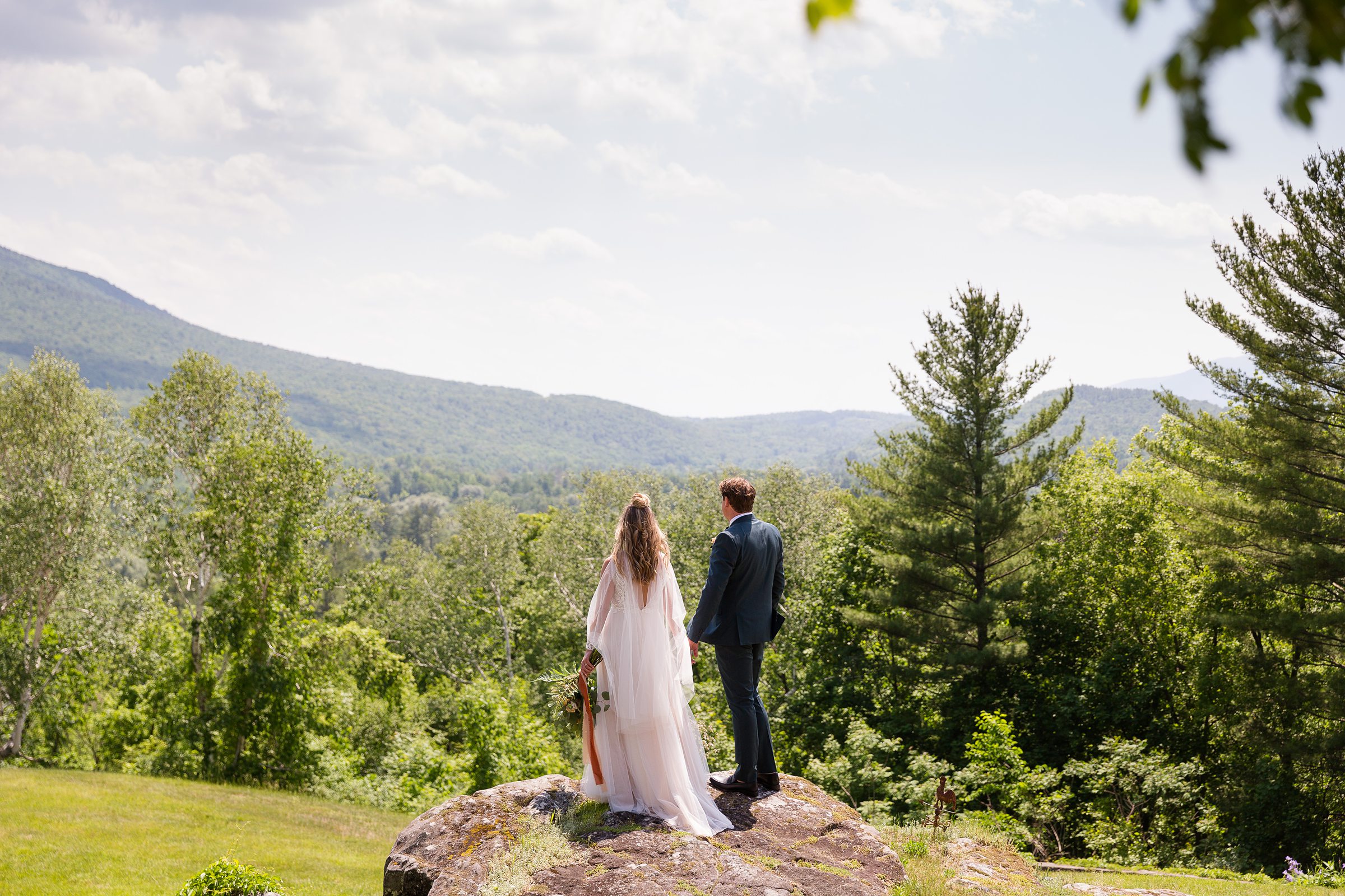 bride and groom looking at the mountains at Wilburton Inn
