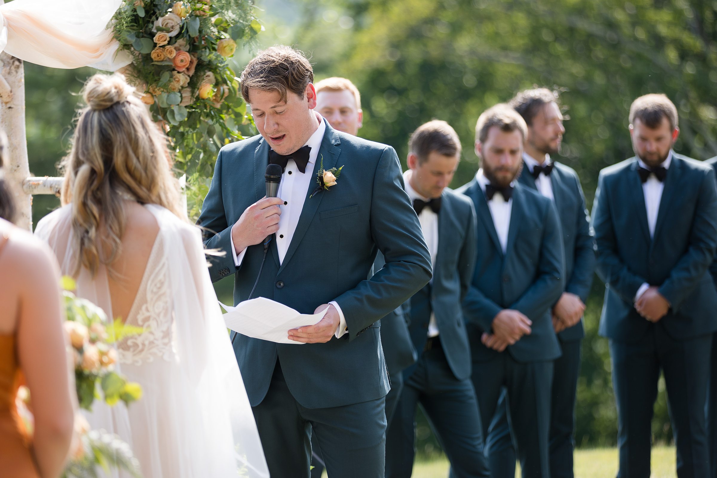 groom vows during outdoor ceremony at Wilburton Inn