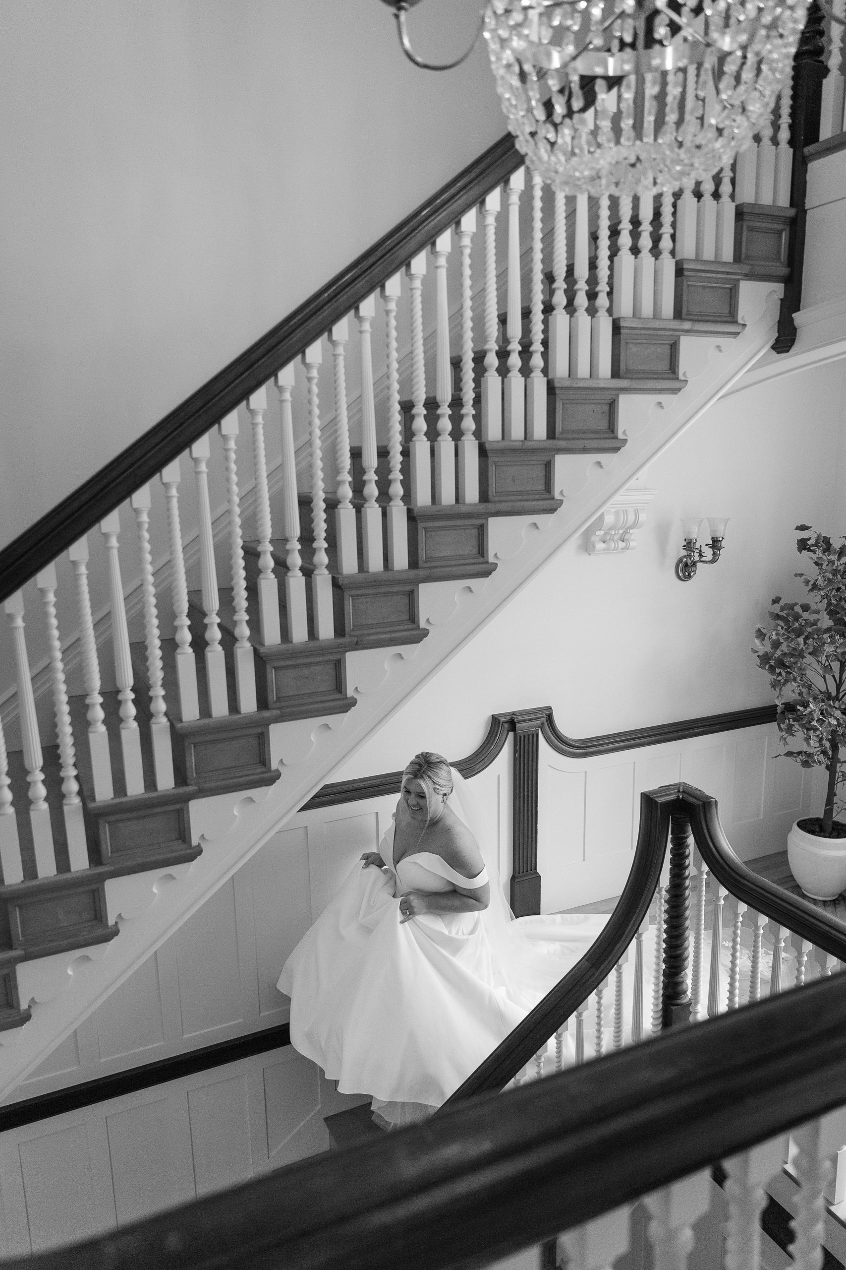 bride walking up the stairs at The Inn at Burklyn 