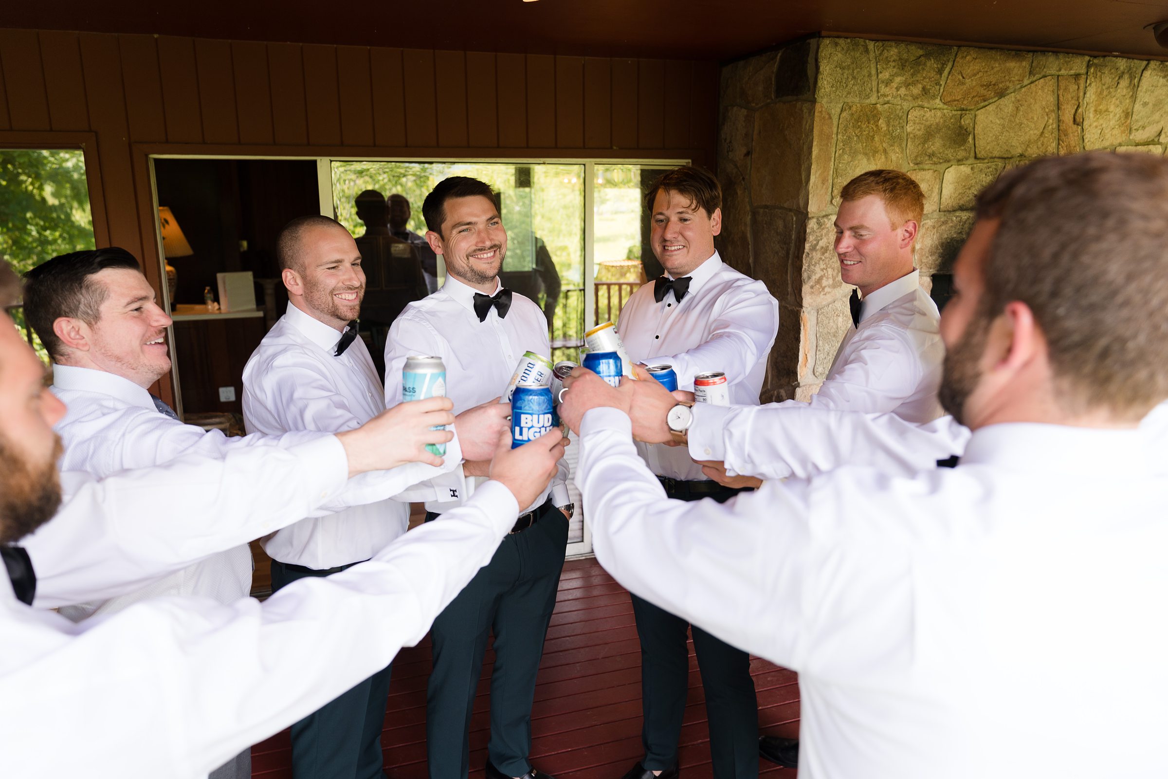 groomsmen doing a toast while getting ready