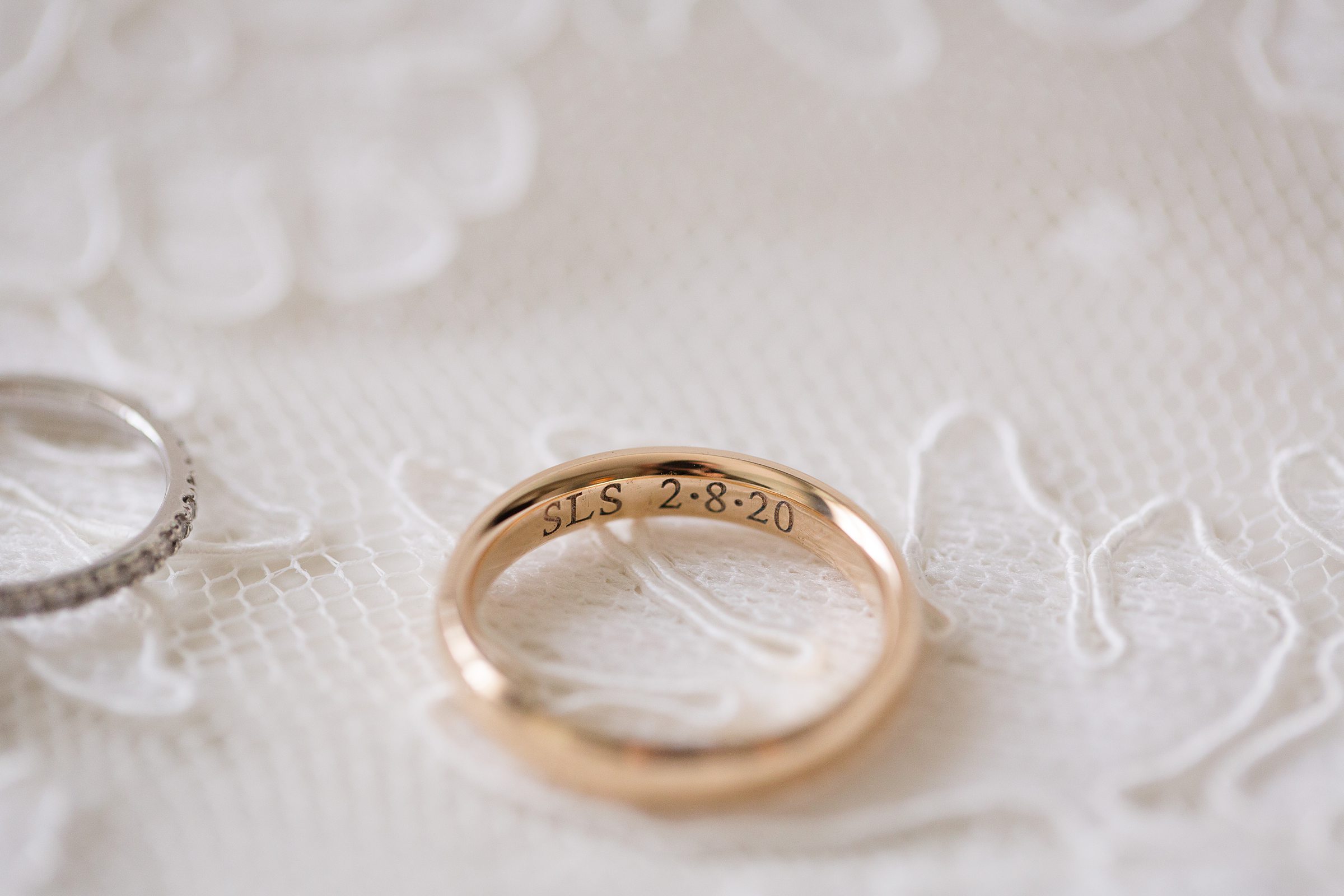 Close up photography of engraved wedding band