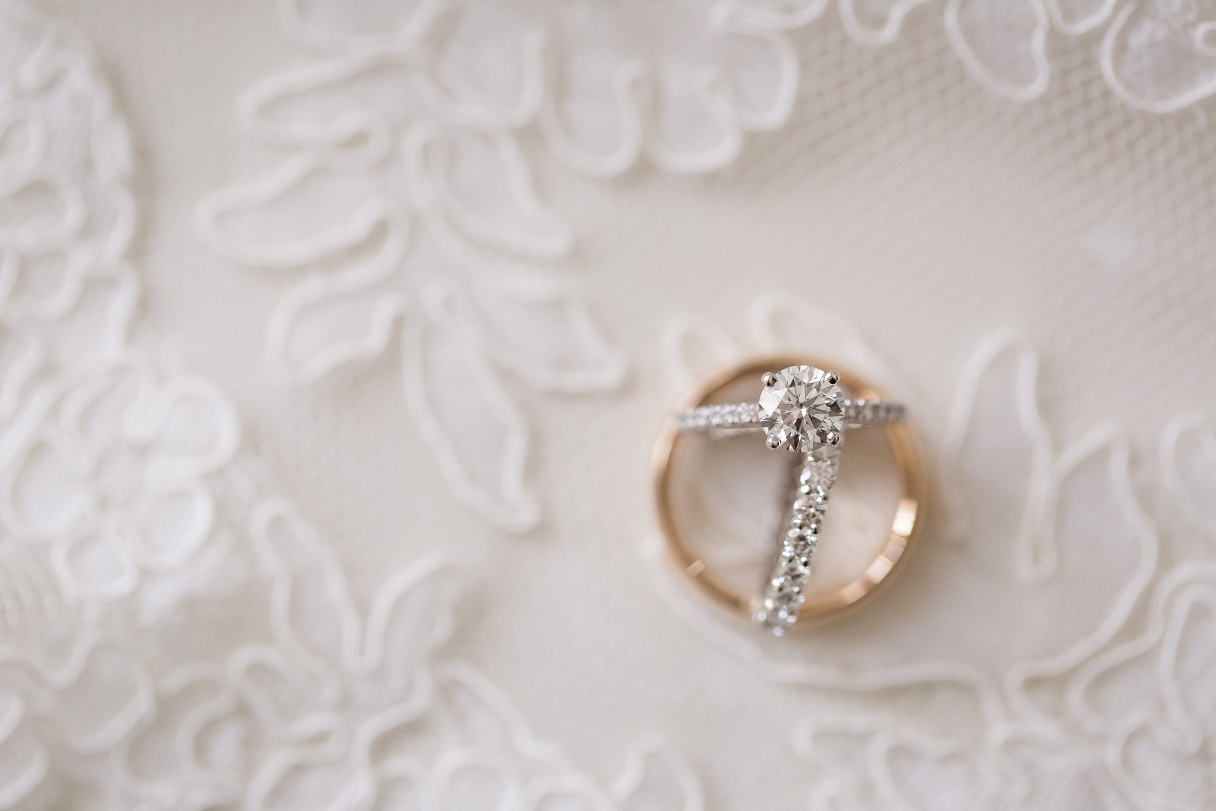 wedding rings and engagement ring detail photography 