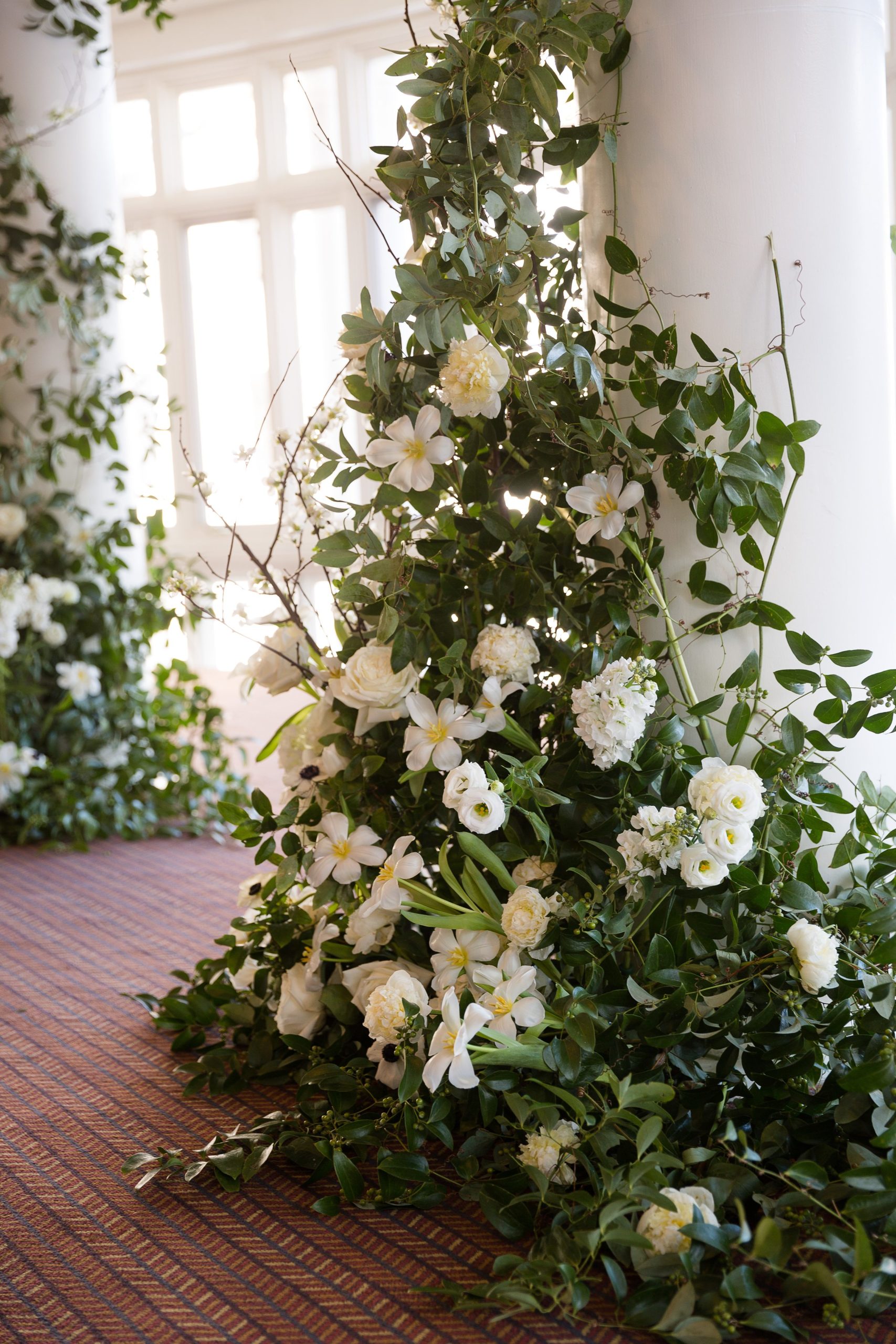 Floral design on the pillars for Vermont wedding