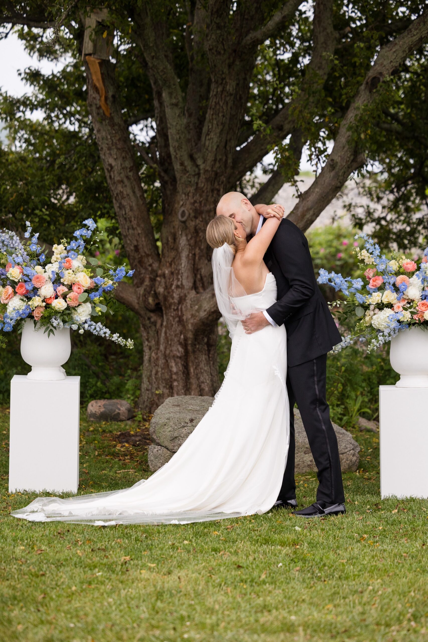 bride and groom kissing at the end of the wedding ceremony