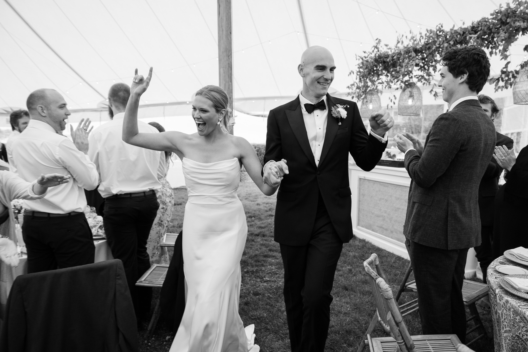 bride and groom entering their reception