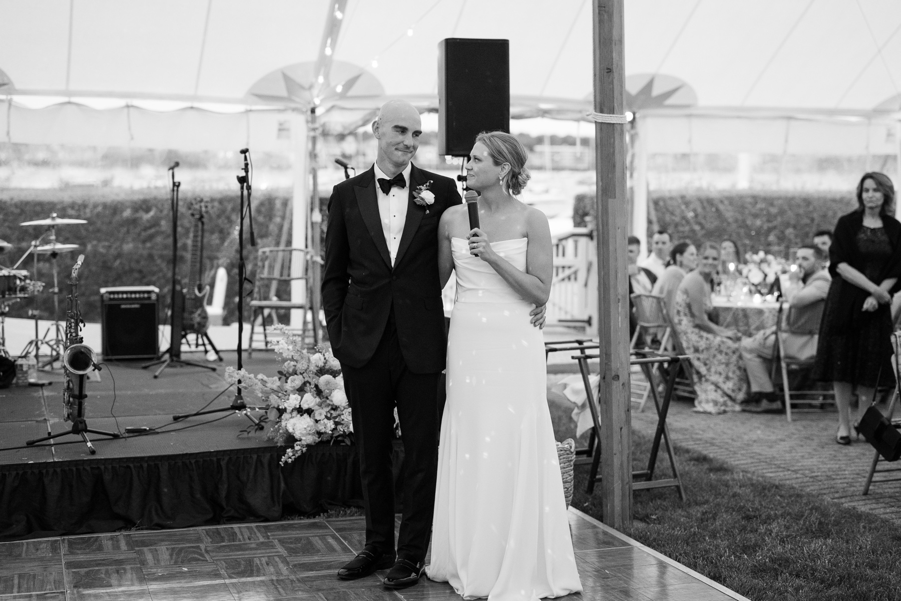 bride and groom giving a speech to their guests