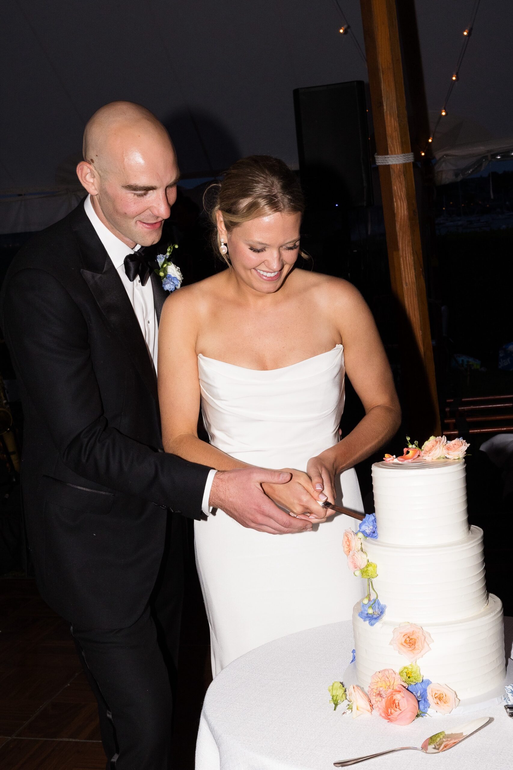 bride and groom cutting cake