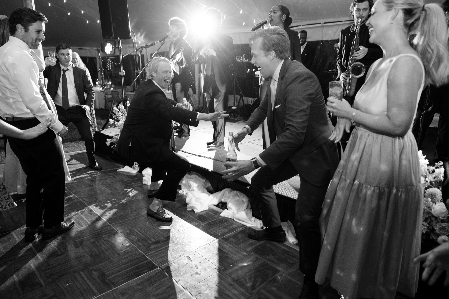 guests on the dance floor with the live band