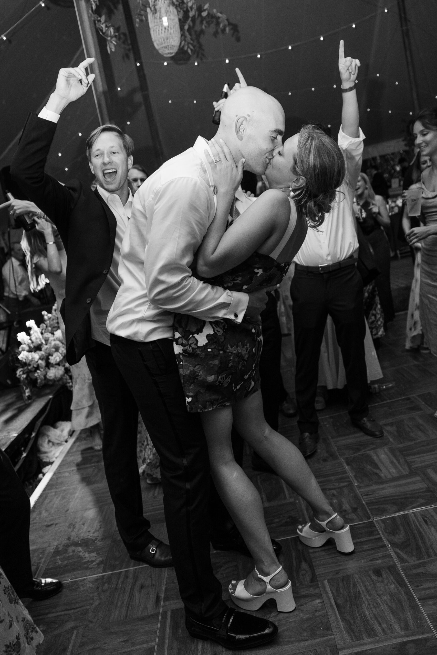 bride and groom kissing on the dance floor